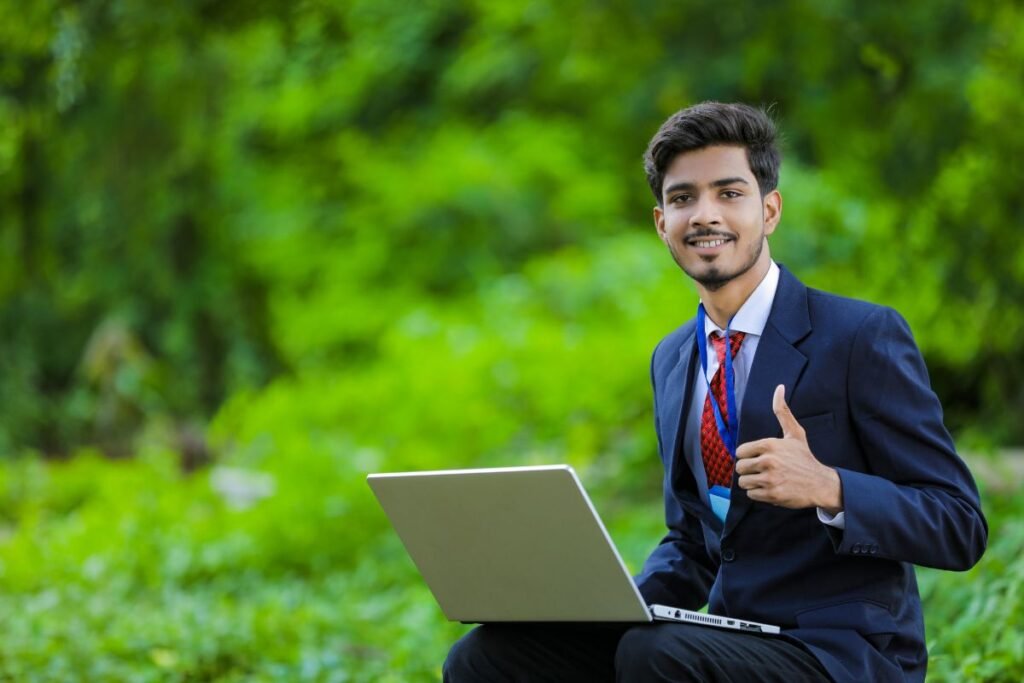 Happy man carrying laptop after choosing BIT as a Career in Nepal