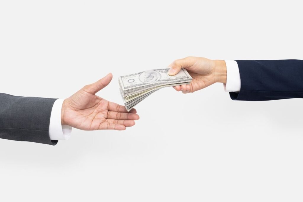 hands exchanging money
