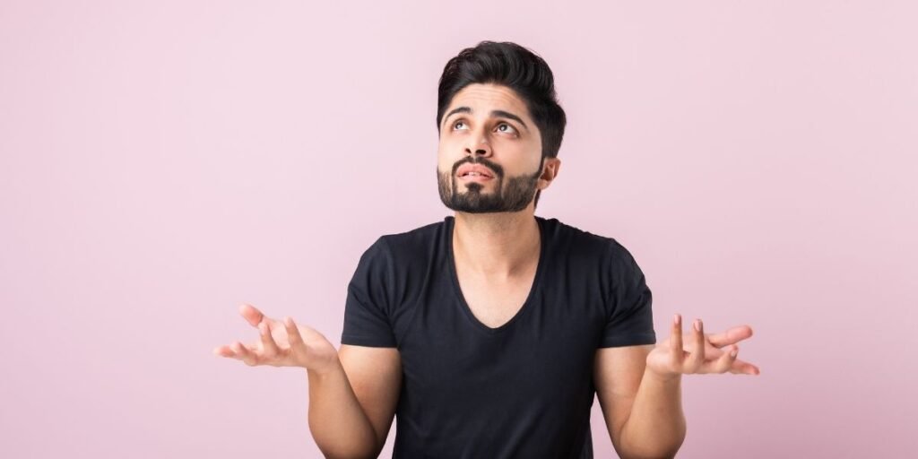 frustrated man in pink background because of common mistake
