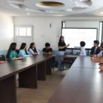 lady instructor on black top leading a bootcamp of IT tools in Texas College of Management and IT