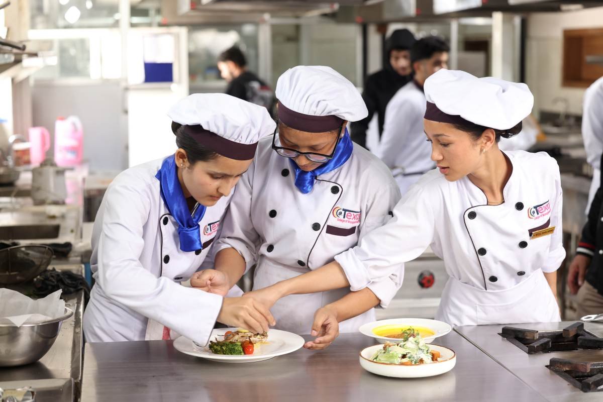 Hotel management courses in Nepal: Texas College students setting a fine-dining table during food and beverage practical training