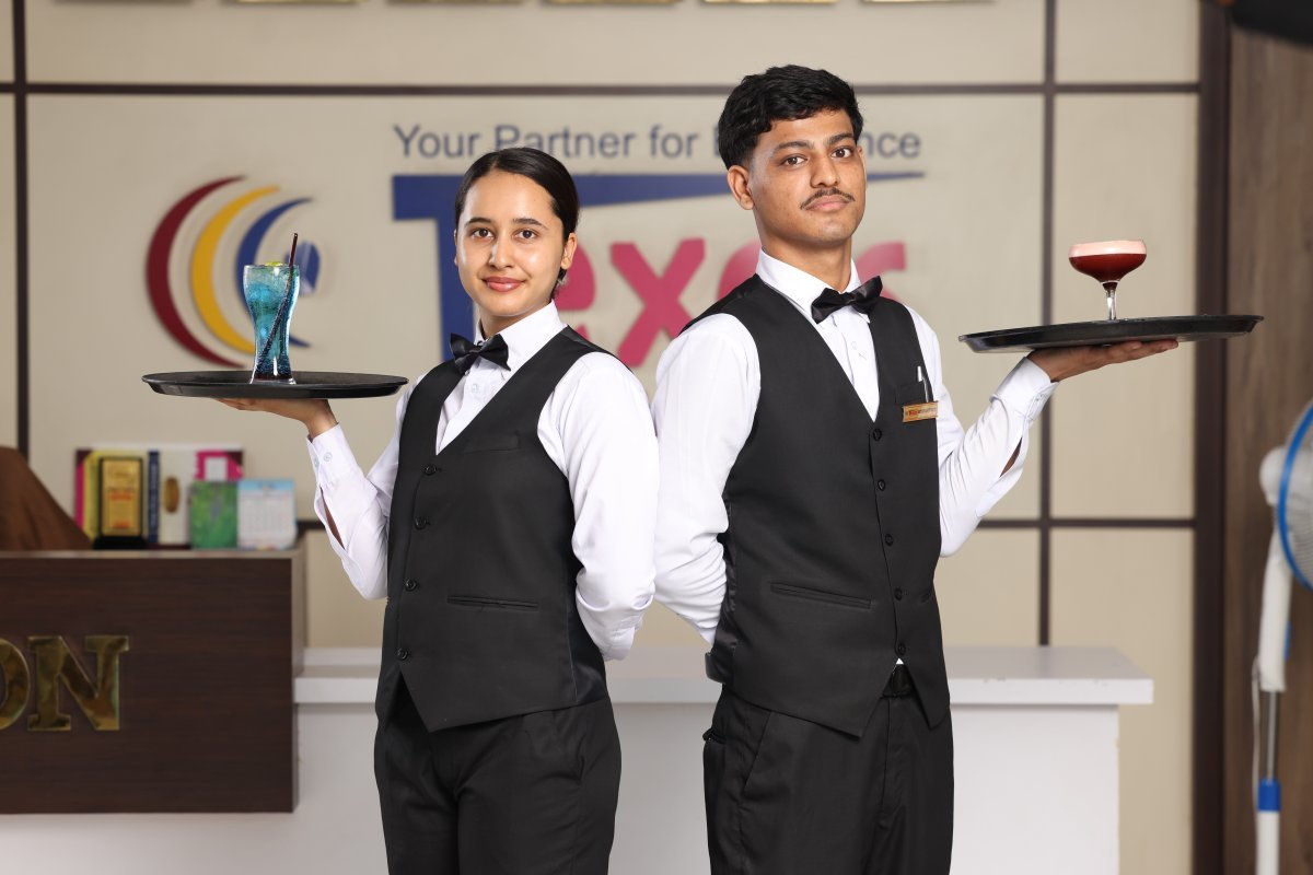 Hotel management courses in Nepal in action: Texas College hospitality students serving beverages during service training