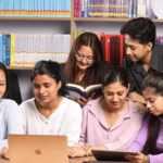 group of young people watching Highest-Paying Jobs After BBA in Nepal on laptop
